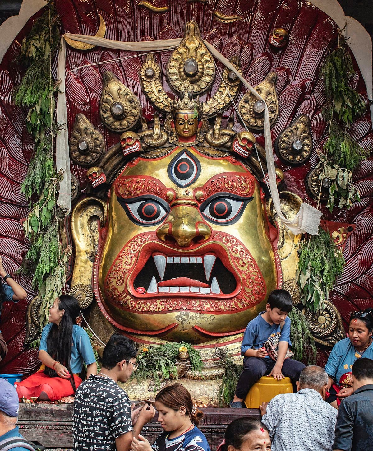 Crowd gathered around a statue during Indra Jatra