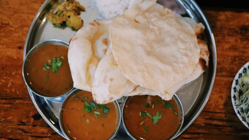 Dal bhat served on a brass plate