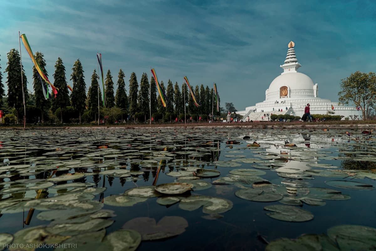 White and gold temple at Lumbini under blue sky