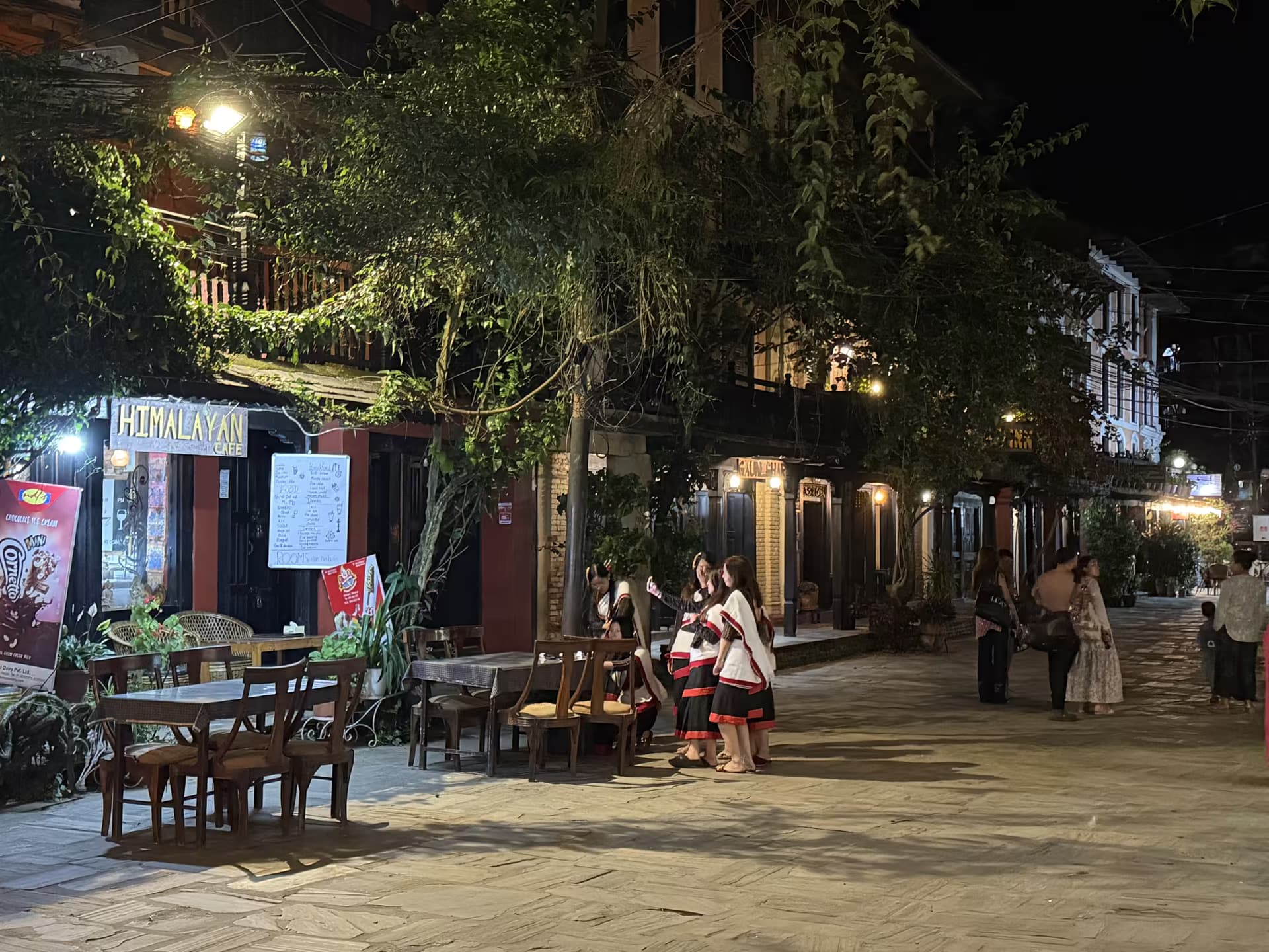 Evening on Bandipur's main street with visitors in traditional dress